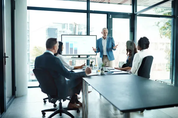 International payroll services — a multi-country finance team reviewing consolidated payroll and social security costs across UAE and overseas entities