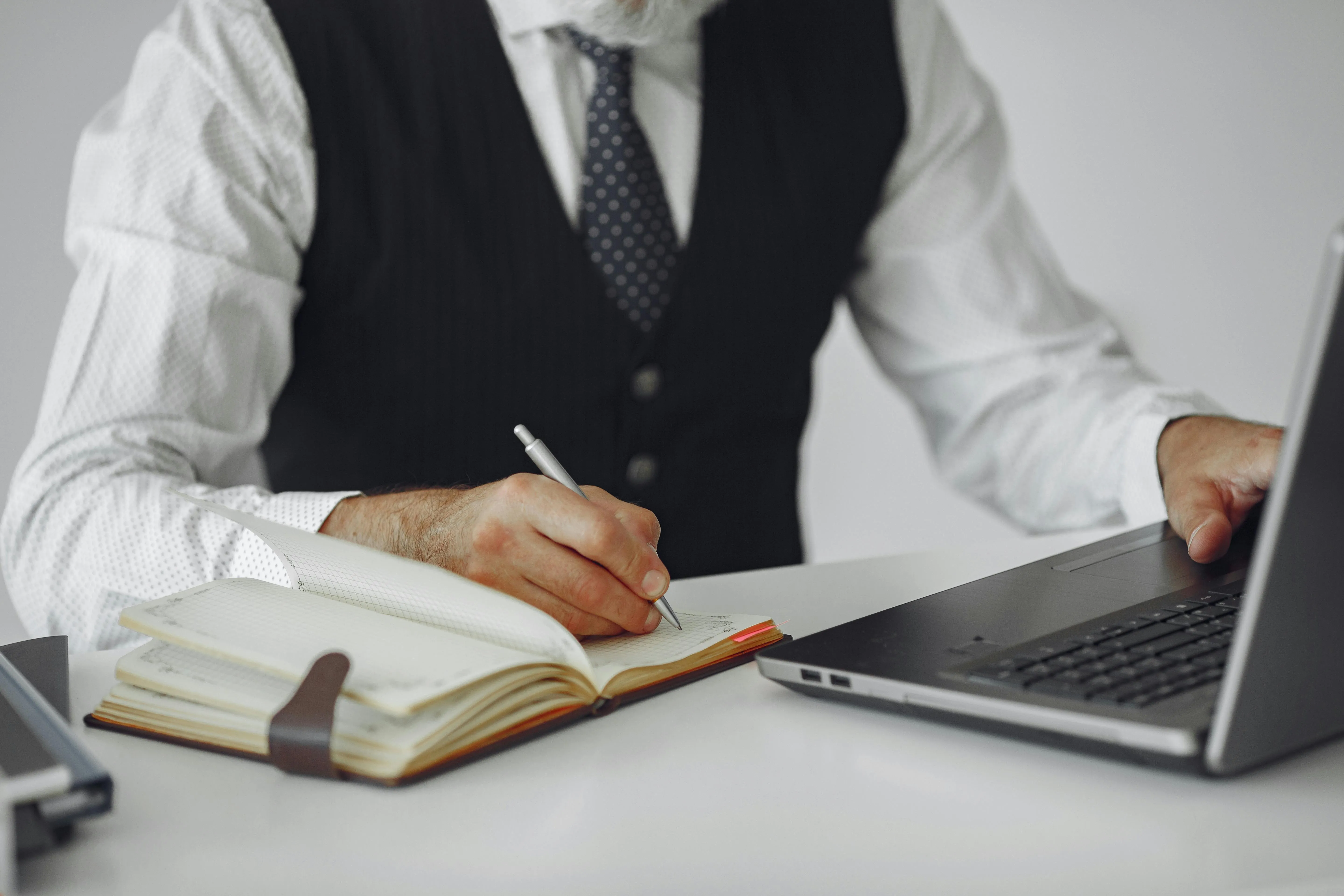 An accountant reviewing a trade receivables ageing report to calculate the provision for doubtful debts