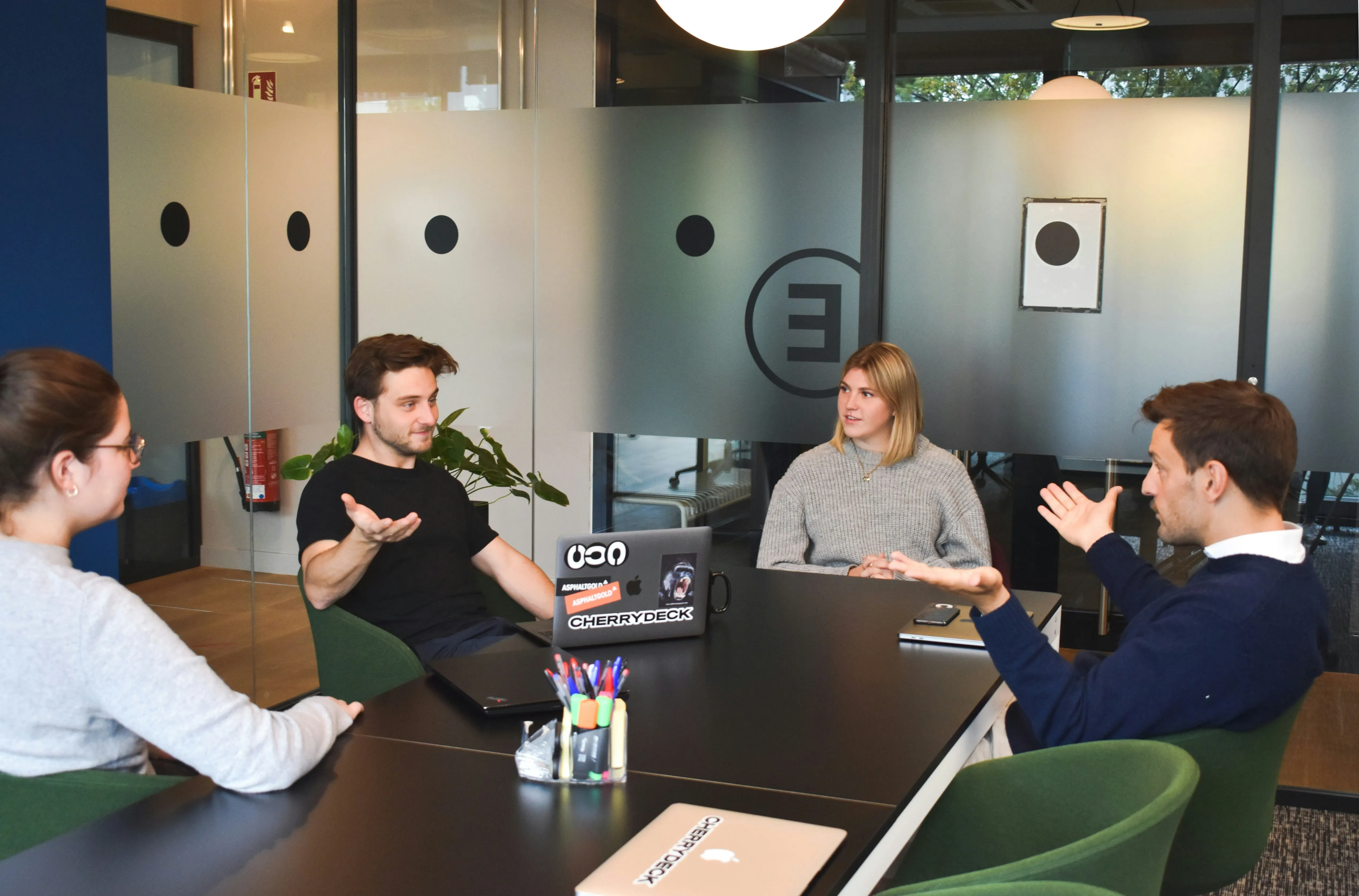 Dubai business owner interviewing a consultant across the six common categories from setup brokers to specialist tax advisors at a meeting room table