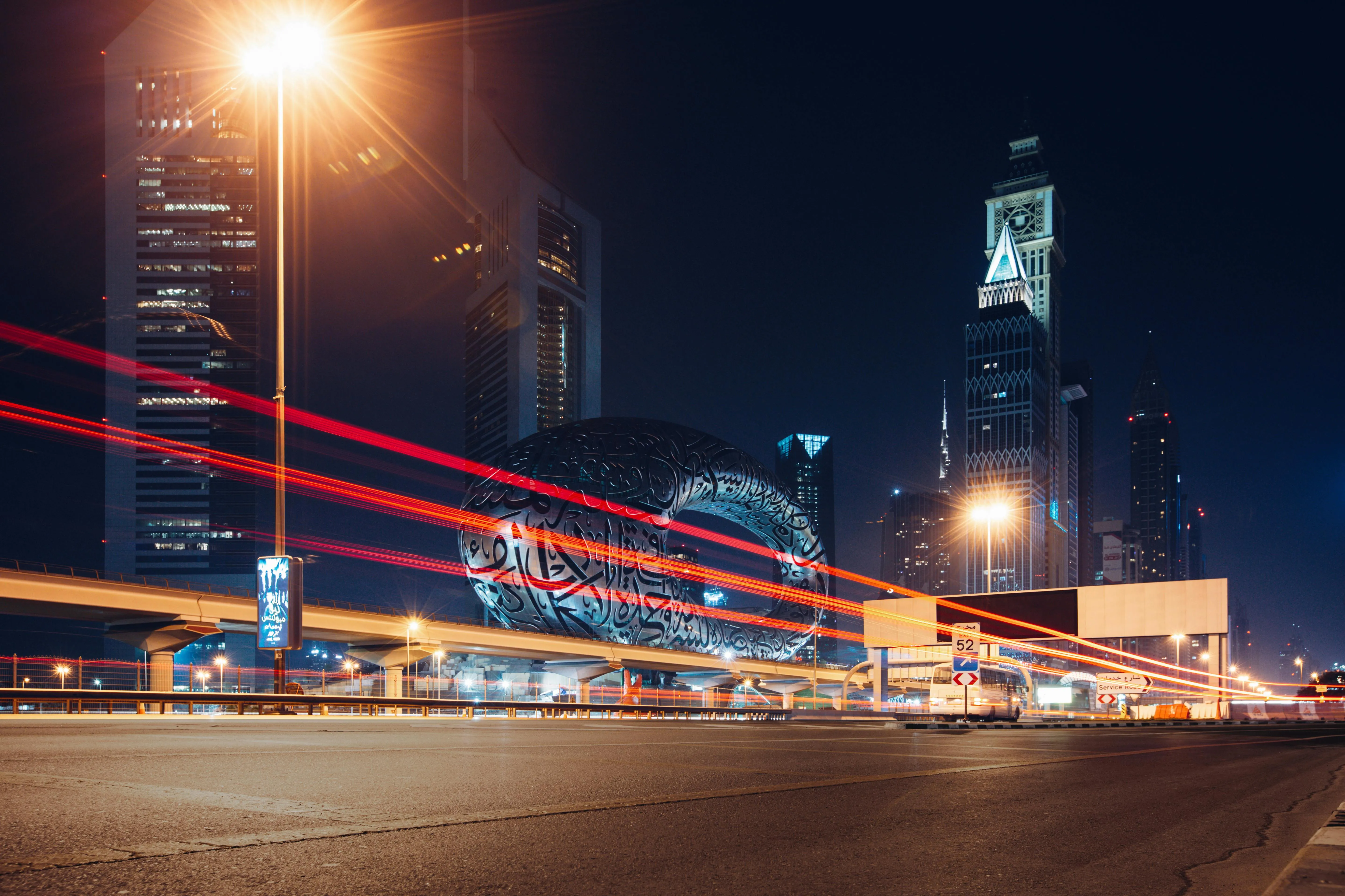 Tax advisor reviewing UAE corporate tax exemption categories under Article 4 with a Federal Decree-Law 47 reference open on the desk
