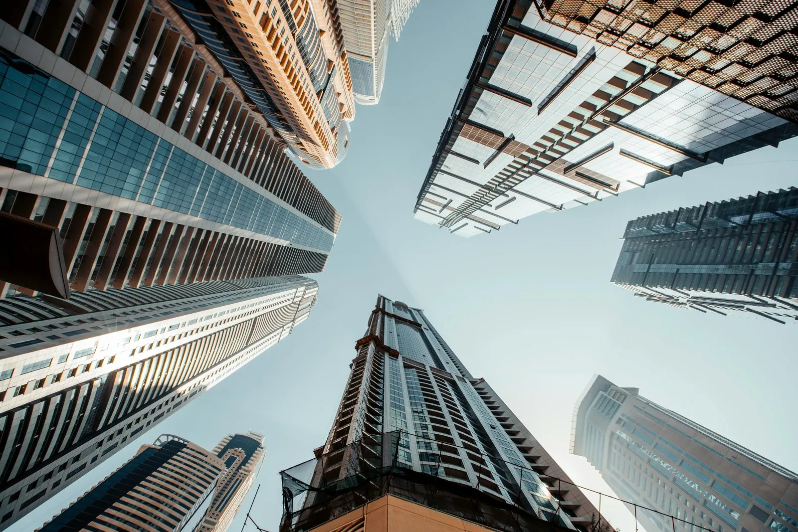 Accountant reconciling IFRS accounting net profit to UAE corporate taxable income, marking non-deductible add-backs against source invoices