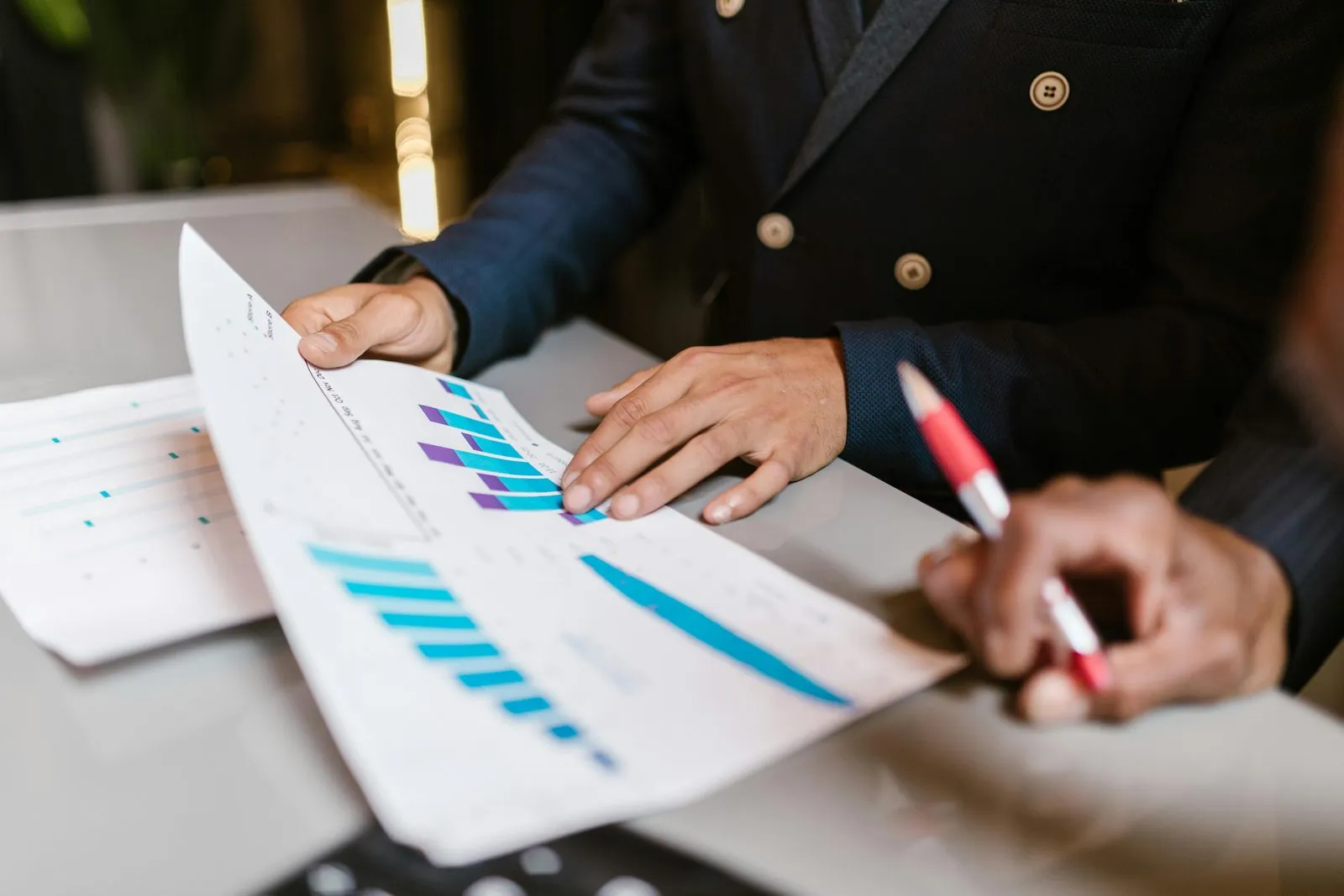 Auditor scoping a UAE engagement by reviewing turnover, transaction volume and multiple bank account reconciliations before quoting a fee