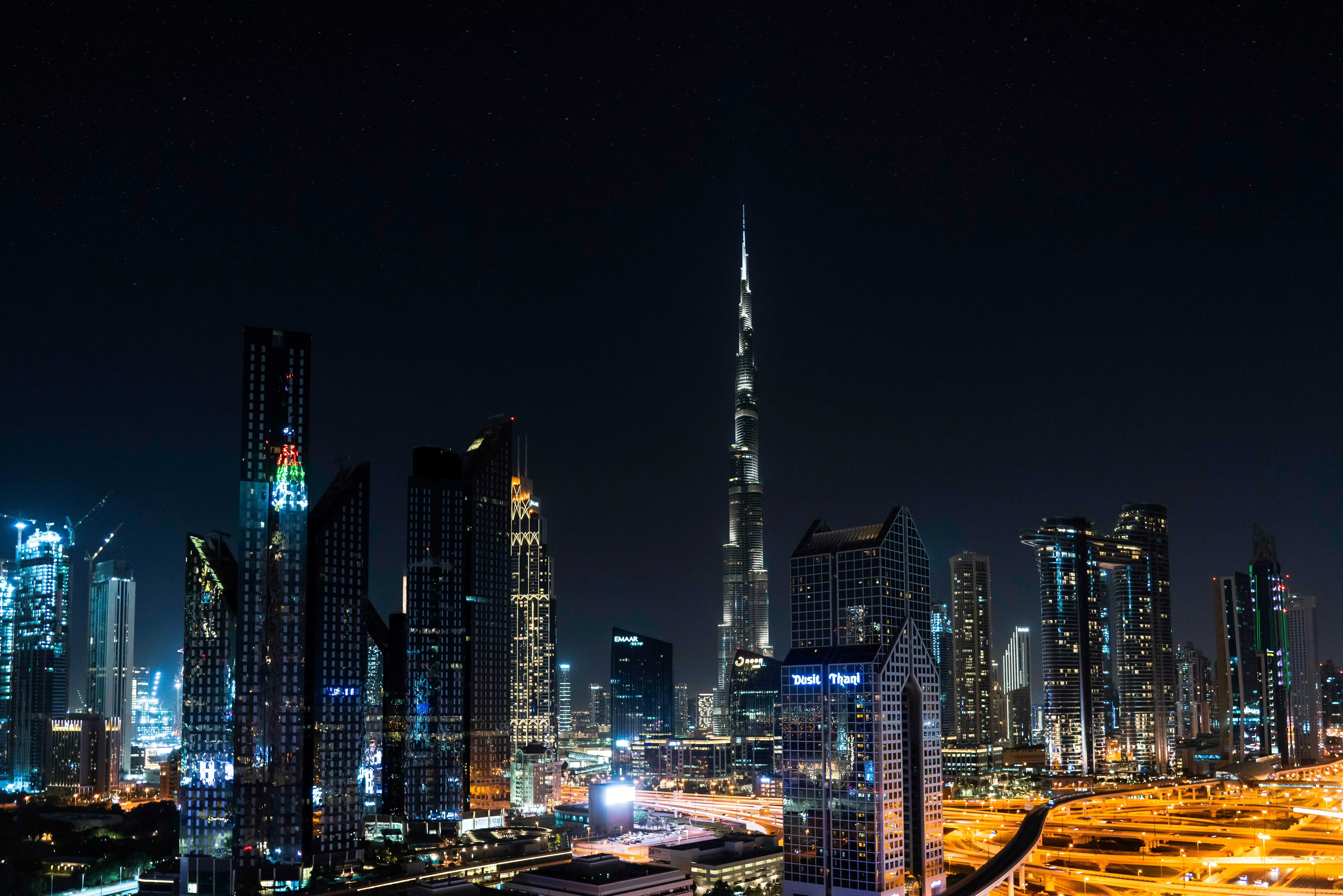 Advisor walking a UAE founder through offshore company structuring options on a planning board with jurisdiction comparison notes