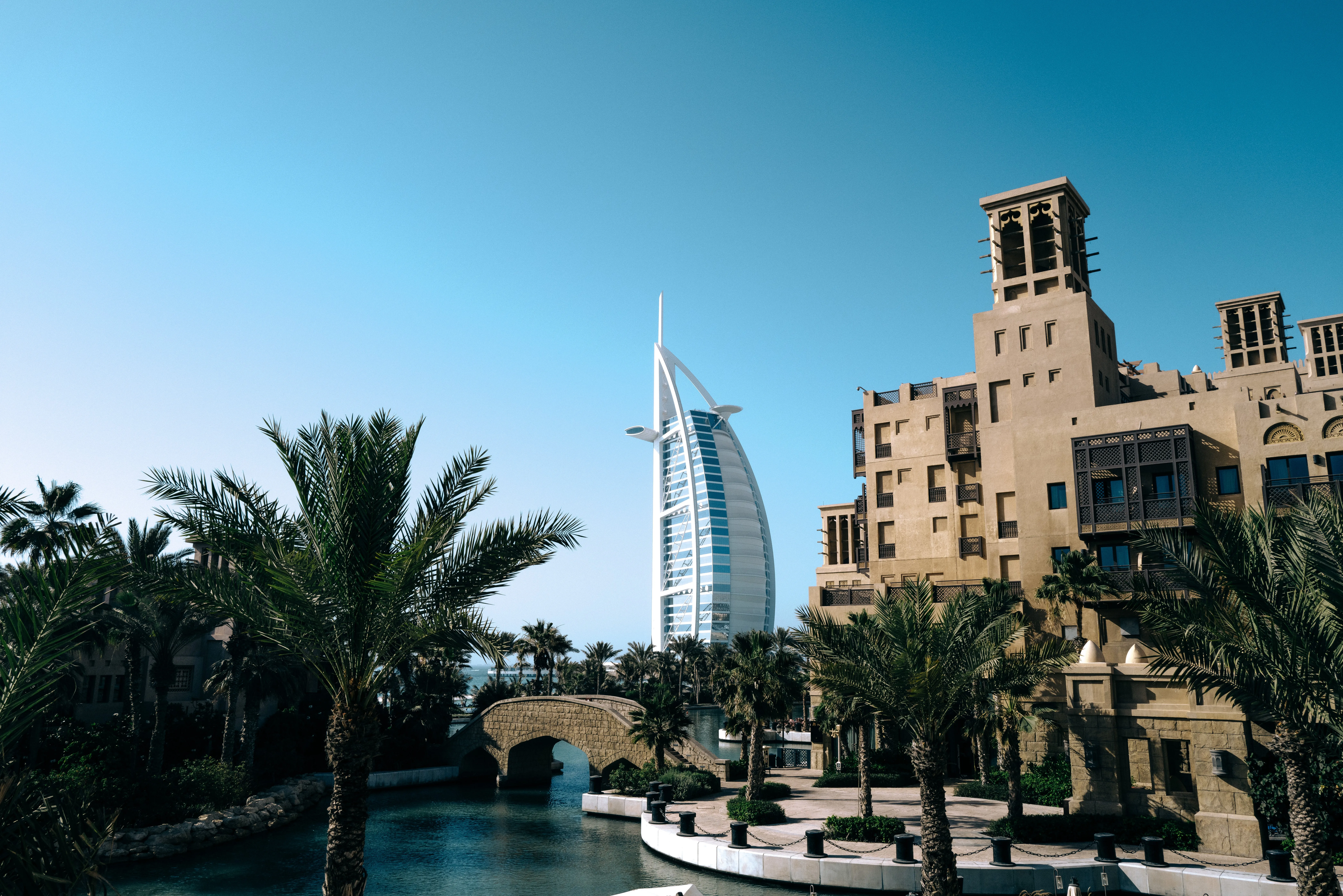 UAE family-office accountant reviewing domestic worker employment contract, salary register and Tadbeer service agreement for end-of-service gratuity accrual
