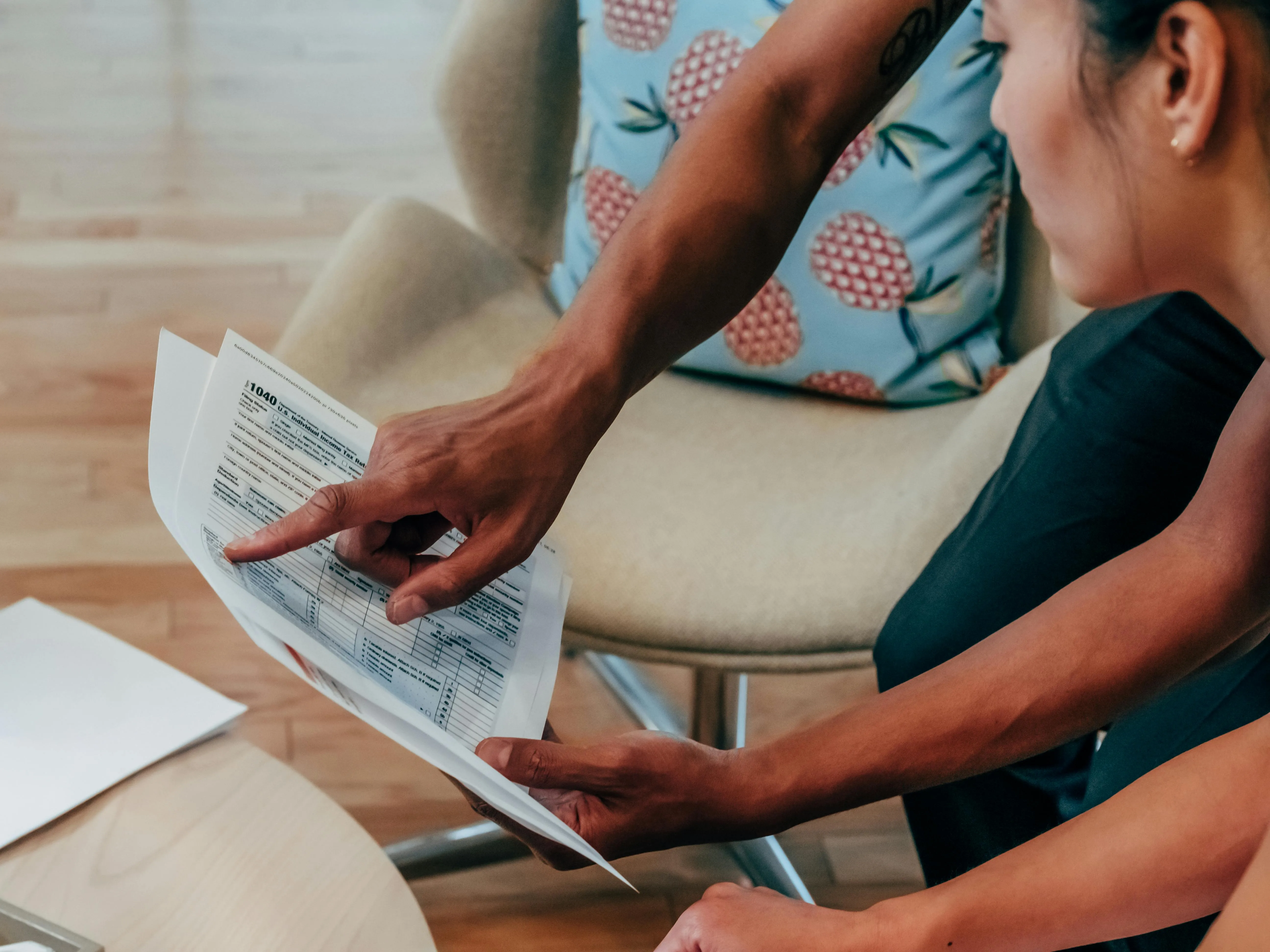 Reviewer highlighting common VAT-201 errors such as reverse-charge misclassification and zero-rated supply mistakes on a printed return