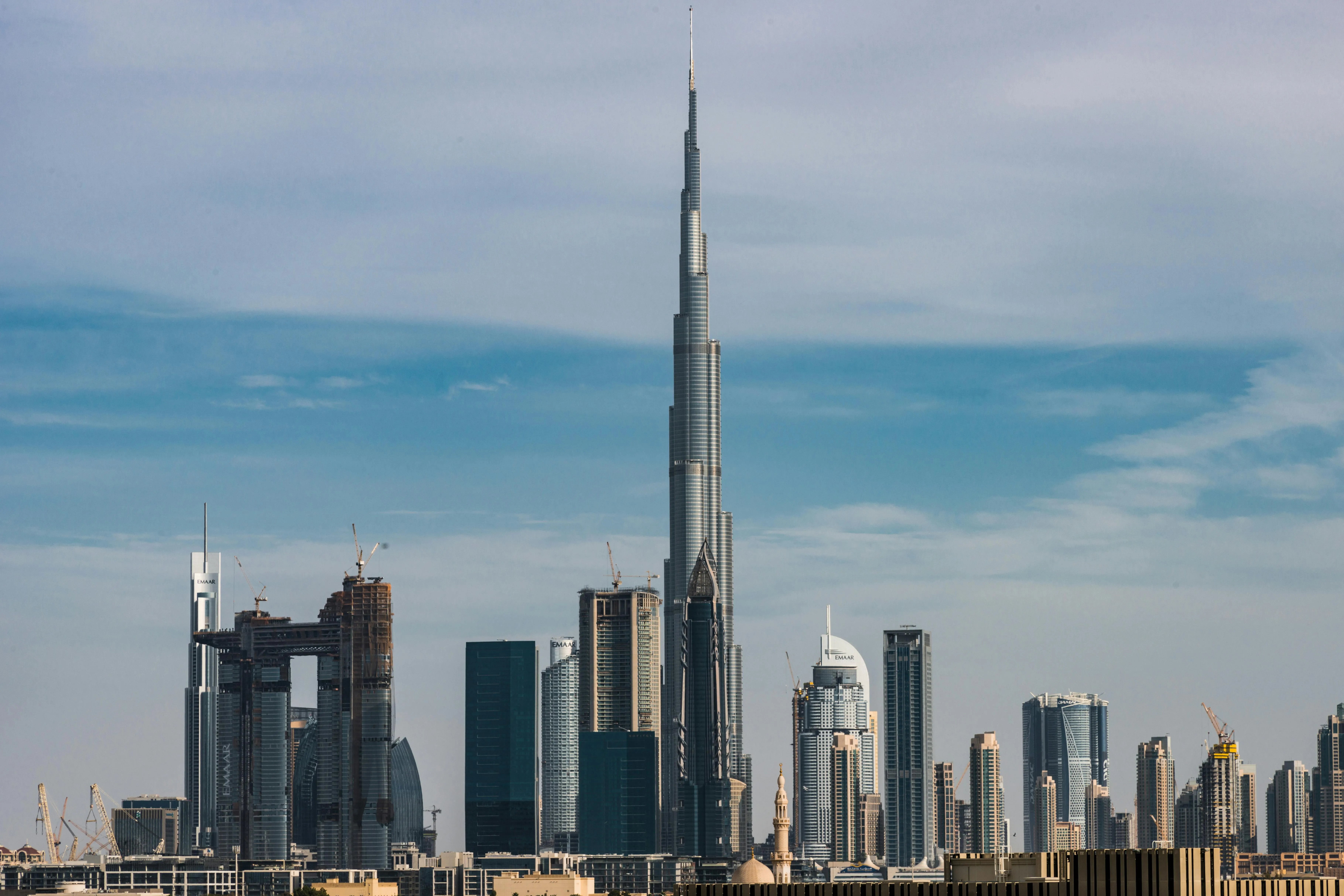 UAE accountant calculating a deferred AED 4.5 million gain on a commercial building transferred between two wholly-owned group companies at net book value