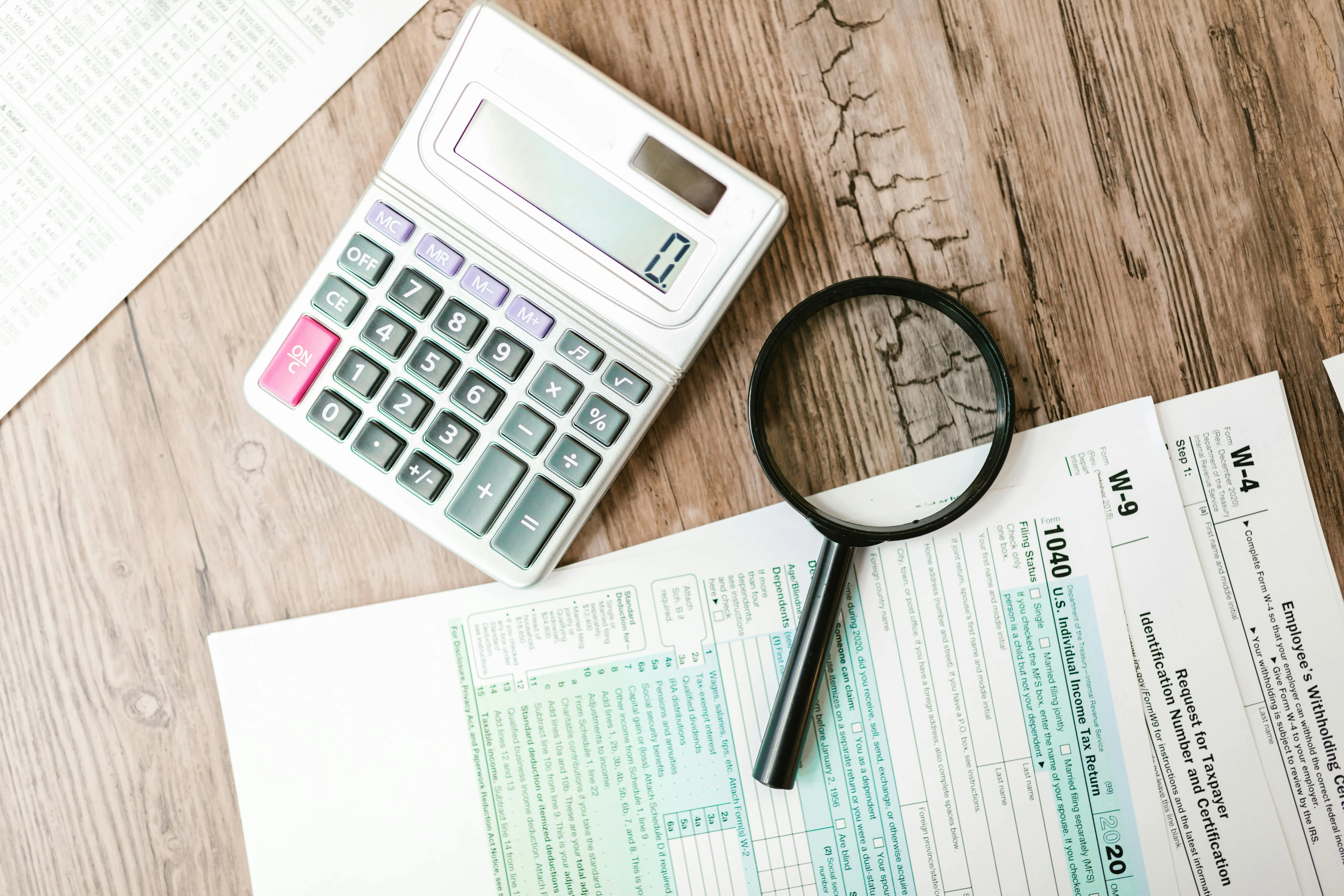 Operations lead working through a day-one post-TRN checklist updating invoice templates, accounting software and tax codes