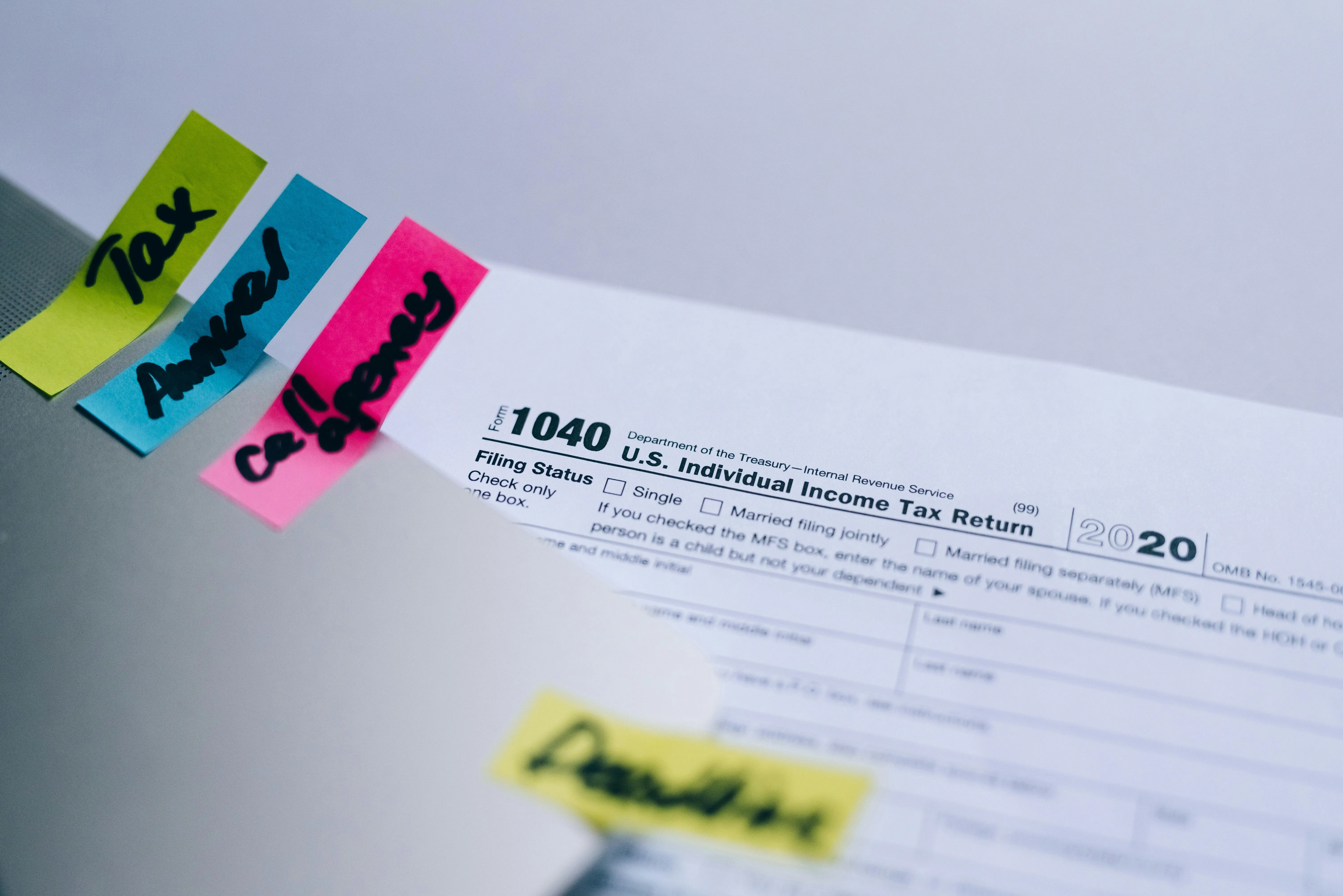 Tax preparer compiling VAT-311 refund claim supporting documents including supplier invoices and bank confirmation for the FTA