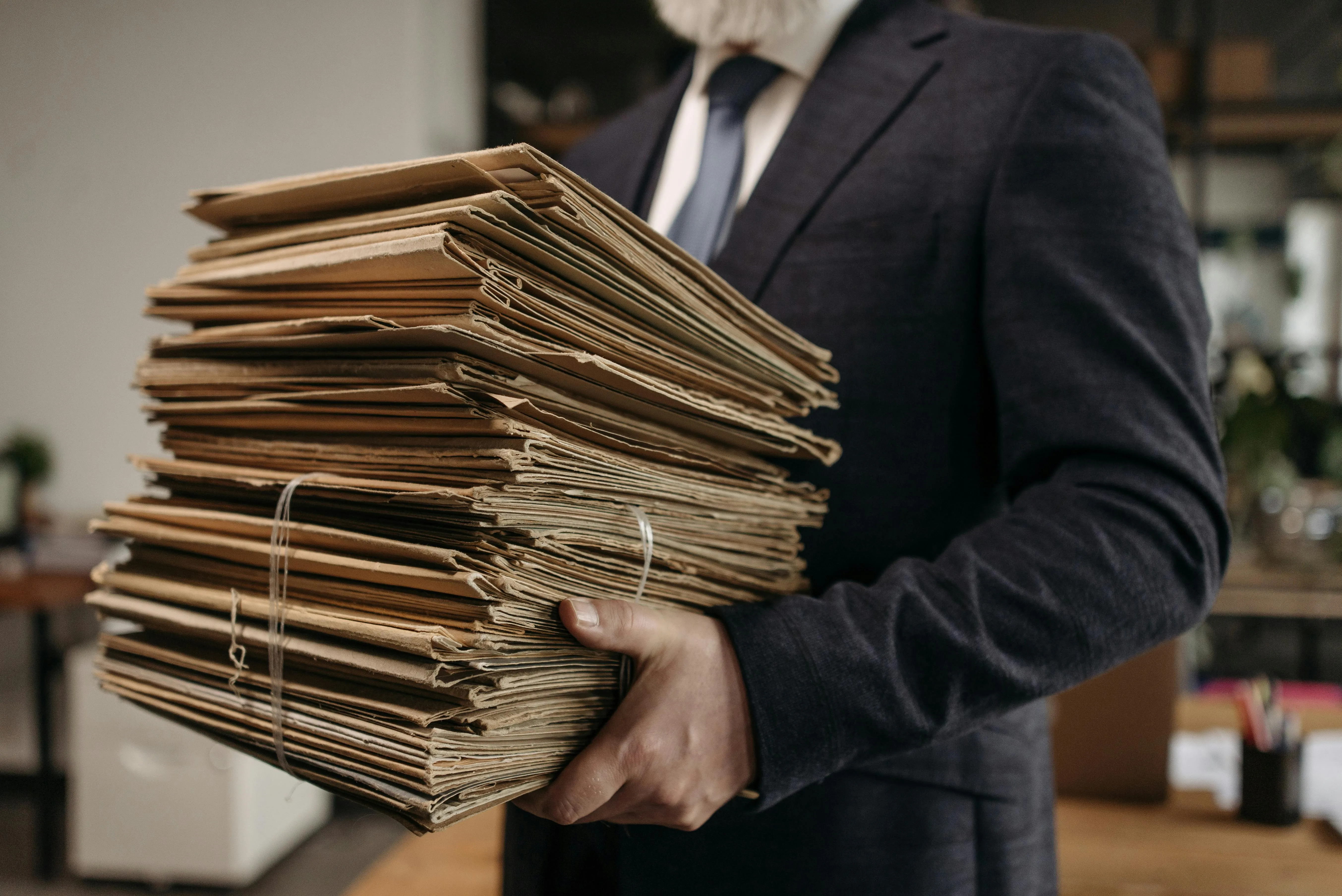 Finance team aligning Economic Substance evidence files with corporate tax registration records for a UAE holding structure