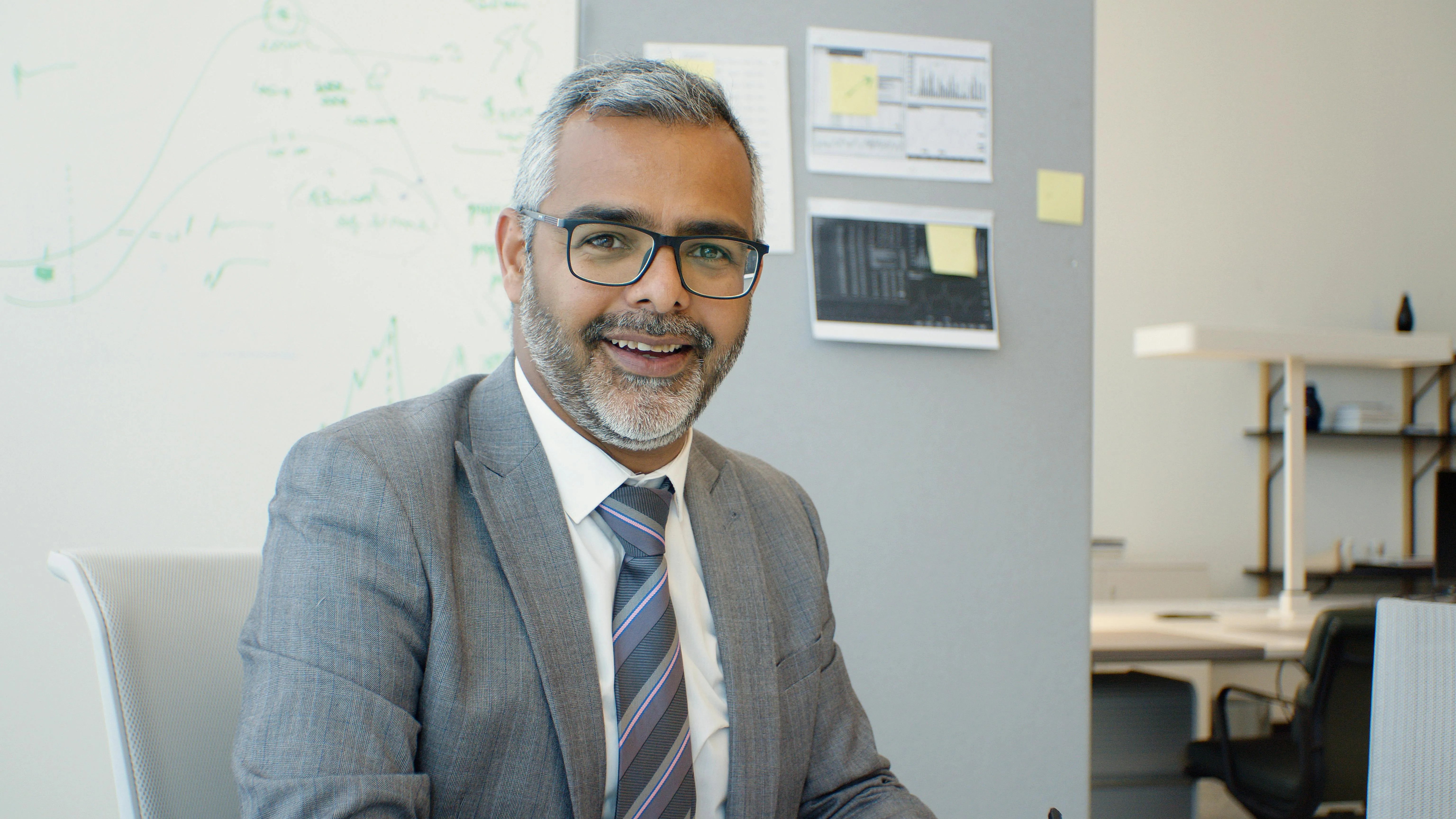 Accountant cross-checking VAT-201 returns against corporate tax workings and audit trial balance for a Dubai SME client