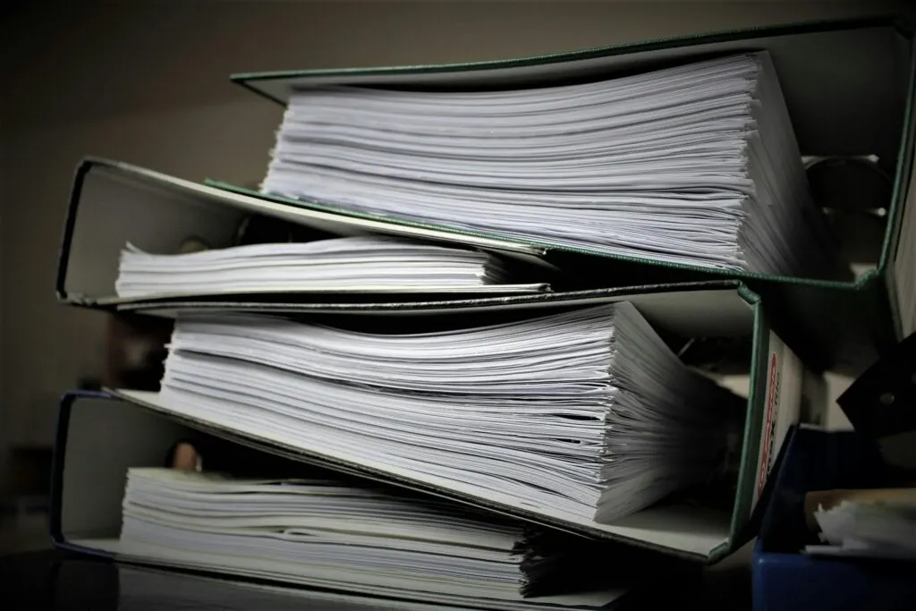 Financial record keeping UAE — accountant organising business documents in Dubai office