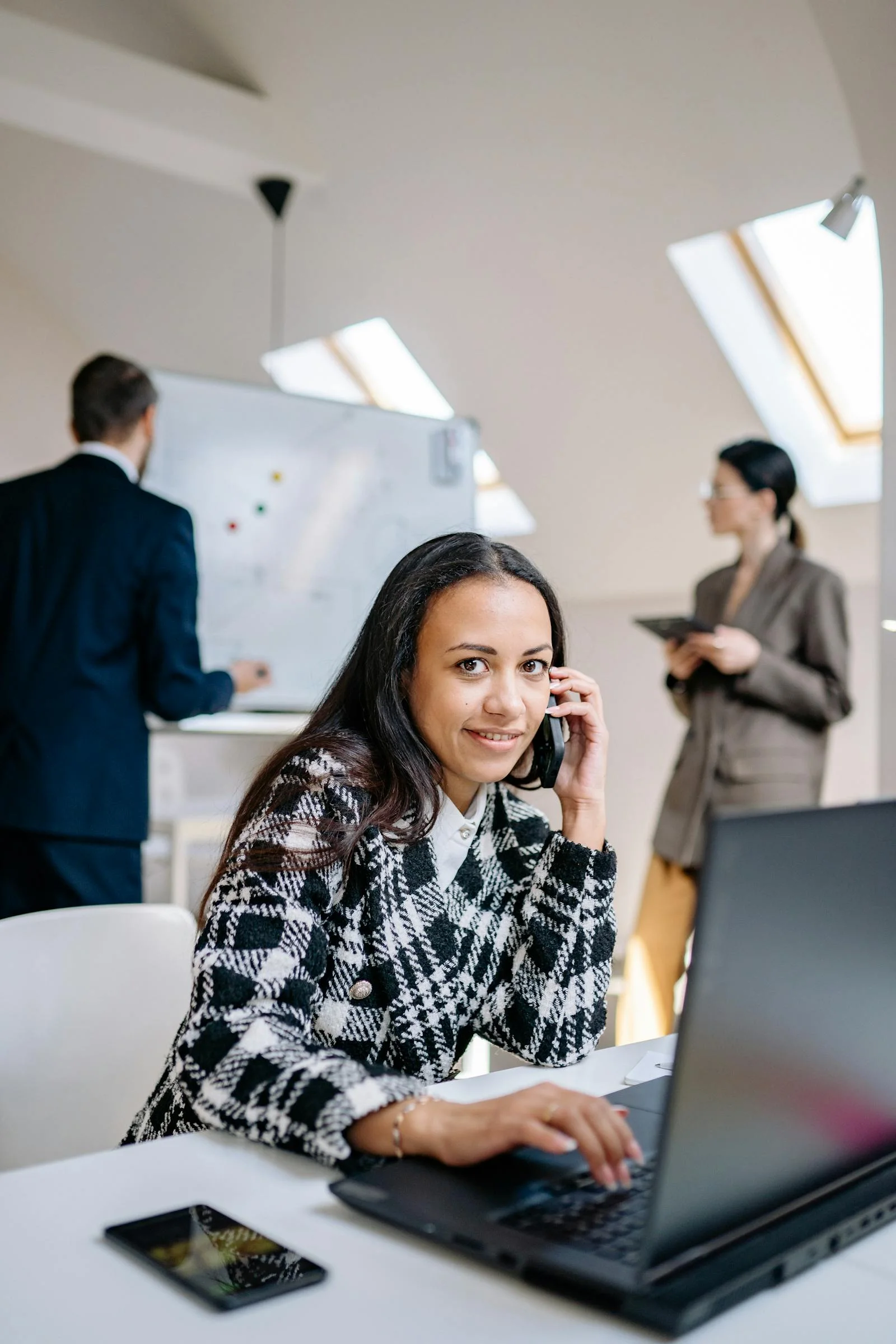 A Dubai consultant on the phone referring a client to Velmont Crest's accounting partner program