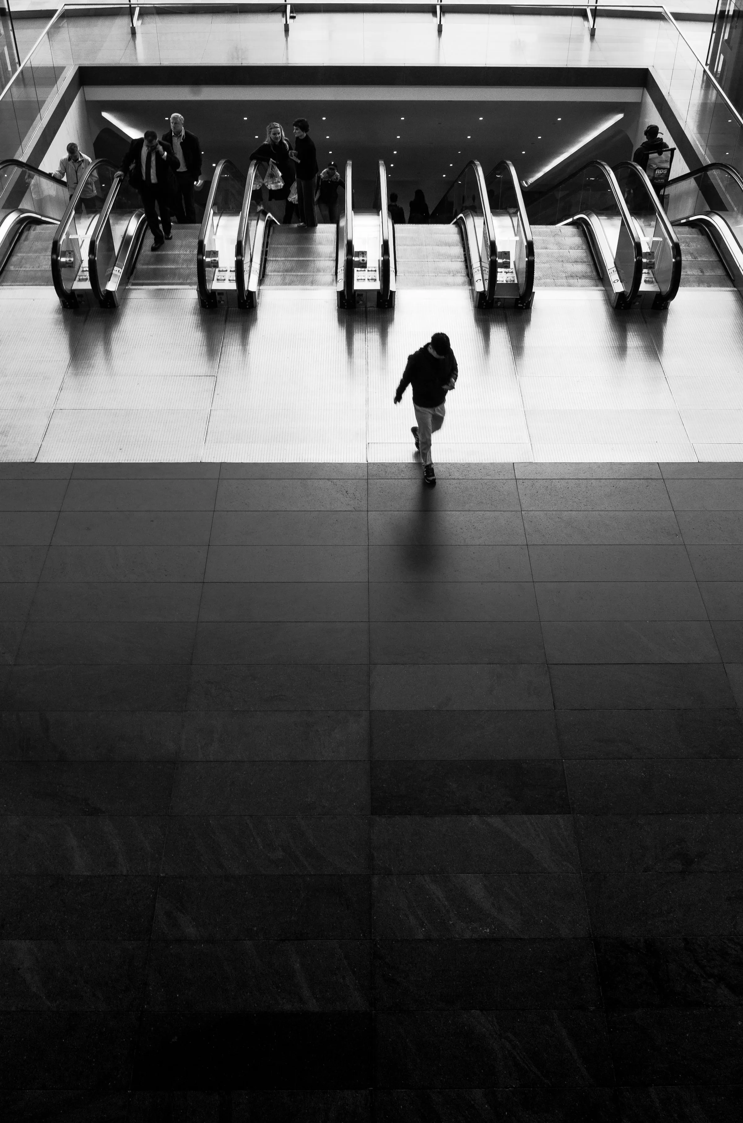 Traveller heading through a transit hall — why you should confirm any UAE travel ban well before booking a flight rather than discovering it at passport control