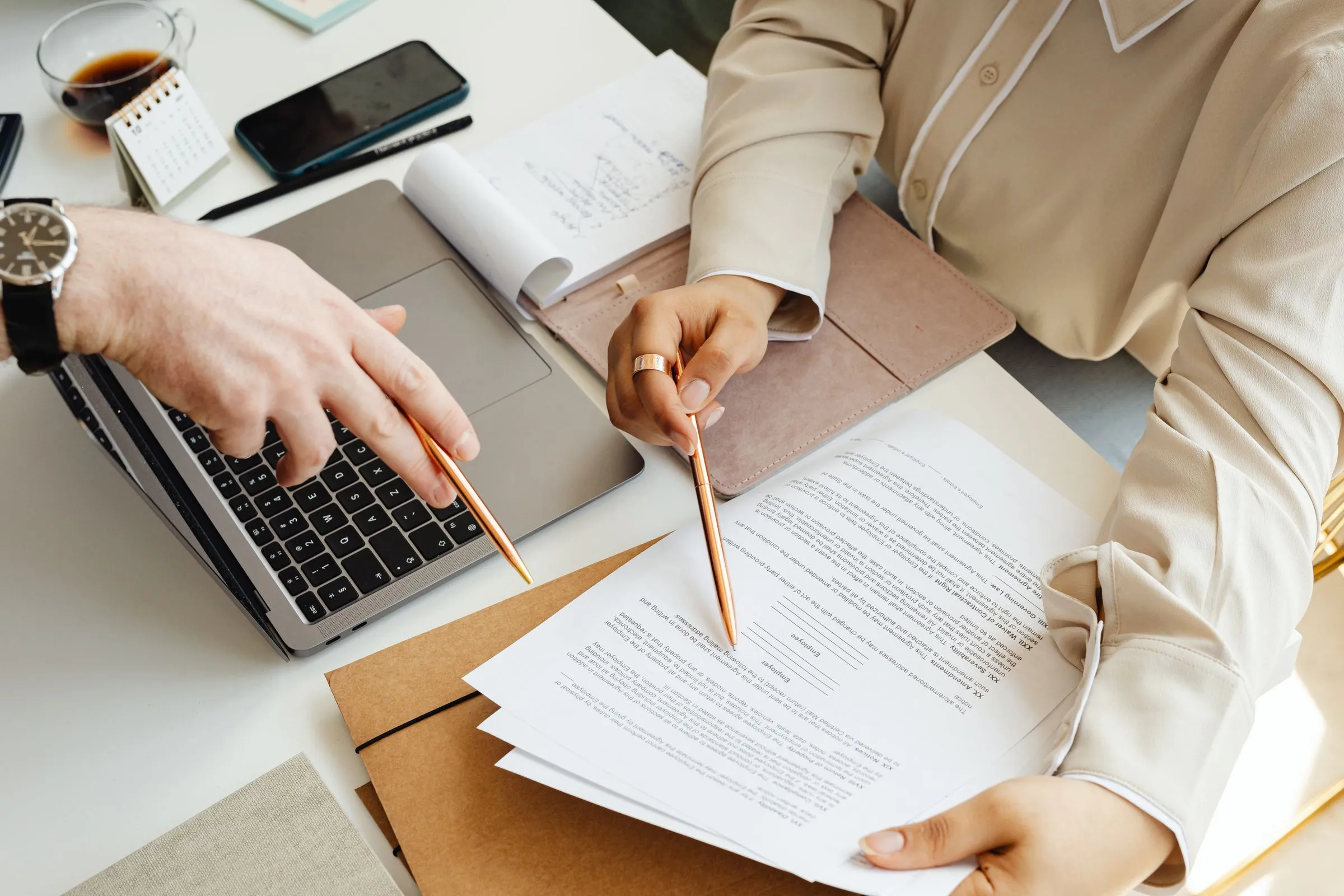 SME owner reviewing fixed fee accounting engagement scope with monthly close calendar and filing deadlines for a Dubai small business