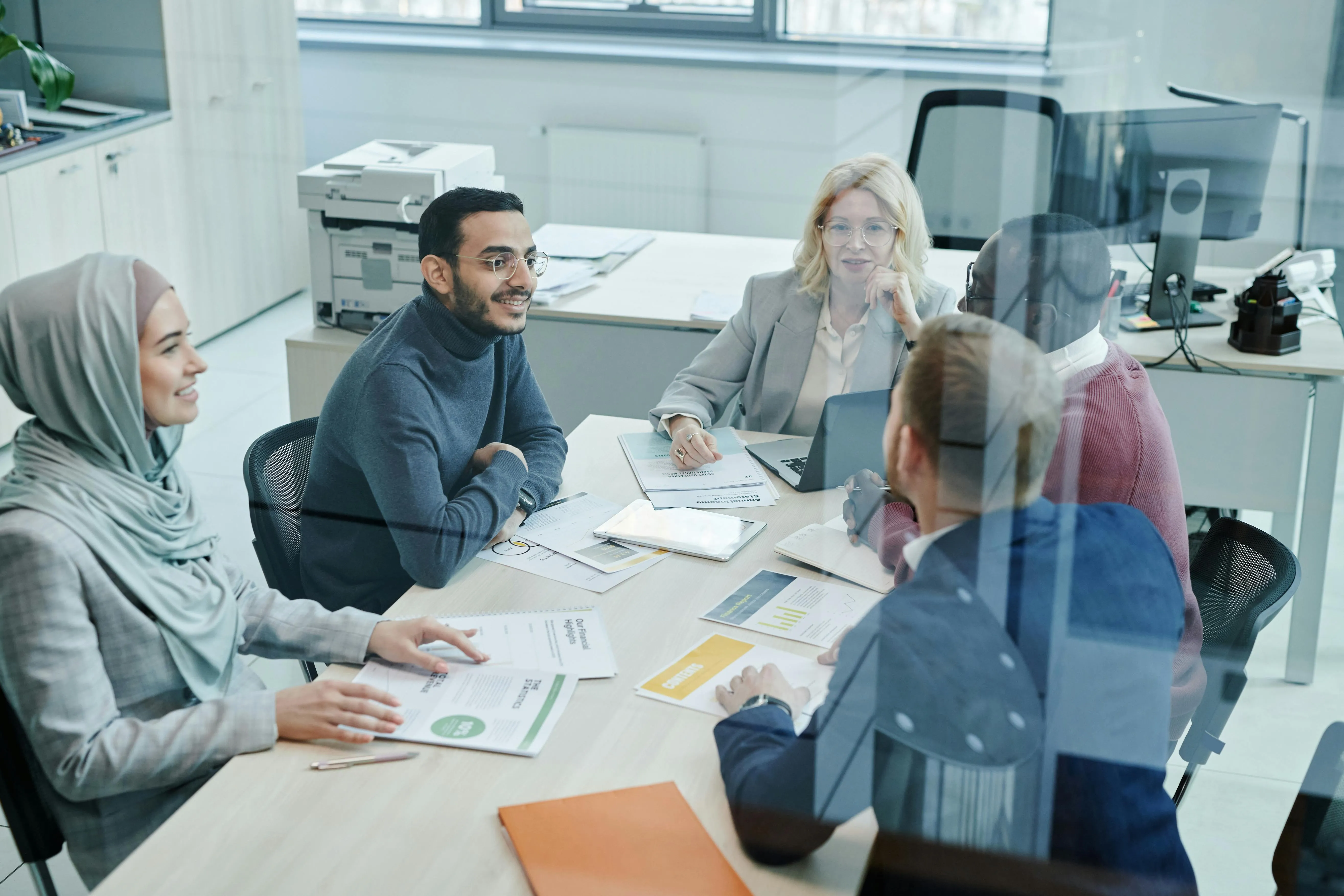 UAE corporate tax exemptions worked through on a desk with calculator and tax documents under Federal Decree-Law 47 of 2022