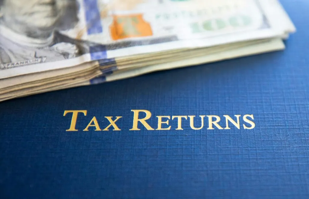 UAE tax changes 2026 — business owner reviewing tax documents in Dubai