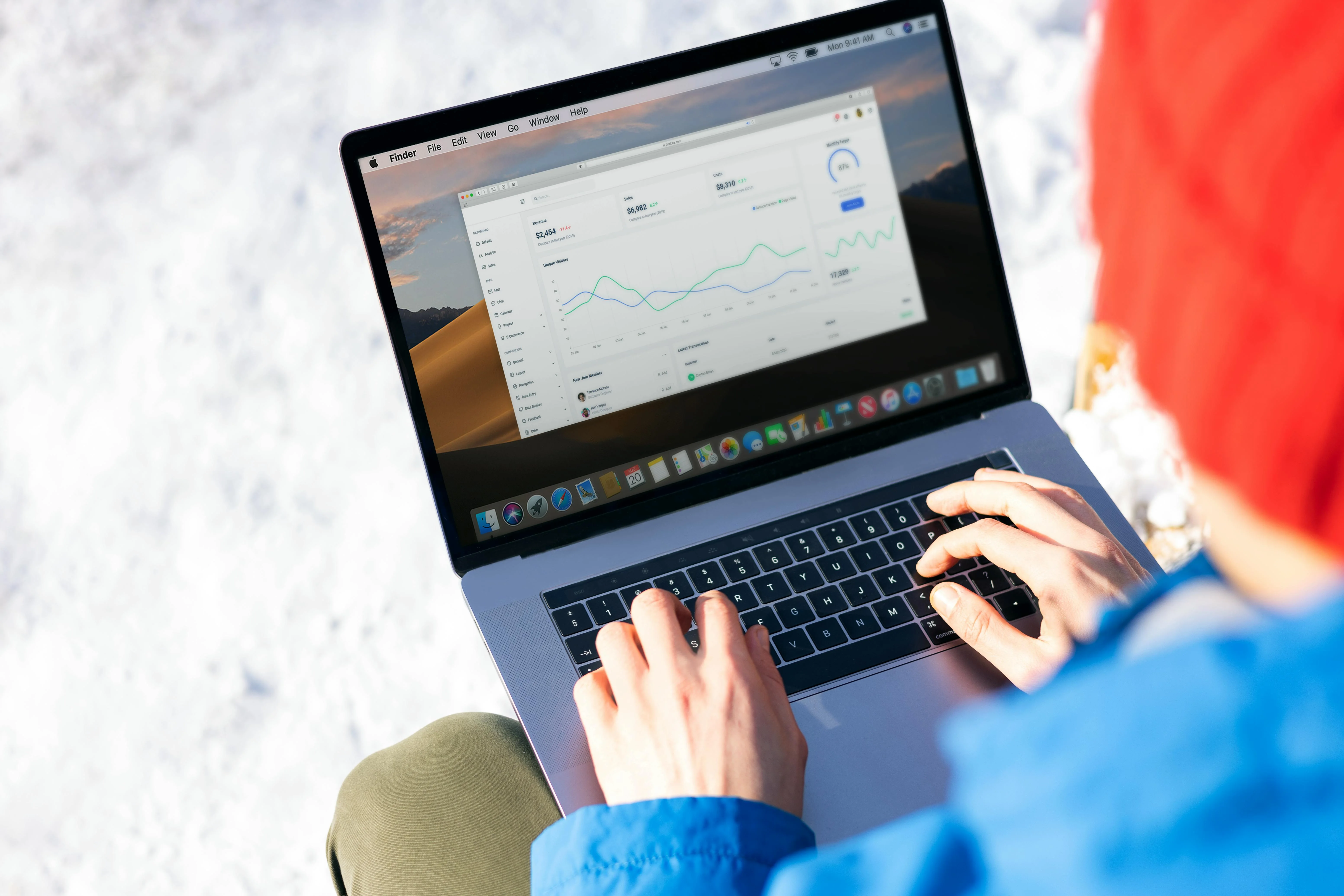 Hands typing at a laptop with a tax-registration form open on screen — step-by-step EmaraTax portal walkthrough for UAE VAT registration, document checklist and TRN issuance